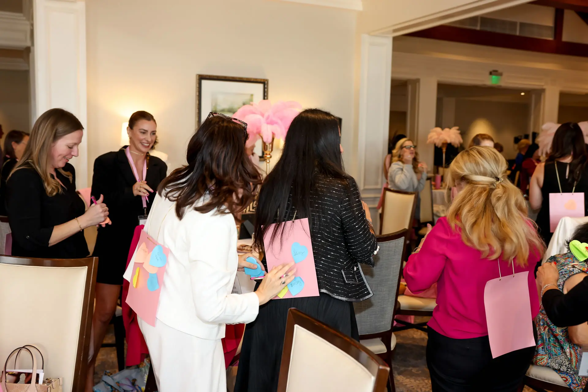 Leslie Alvarez leading an interactive team-building exercise with professional women during a leadership workshop.