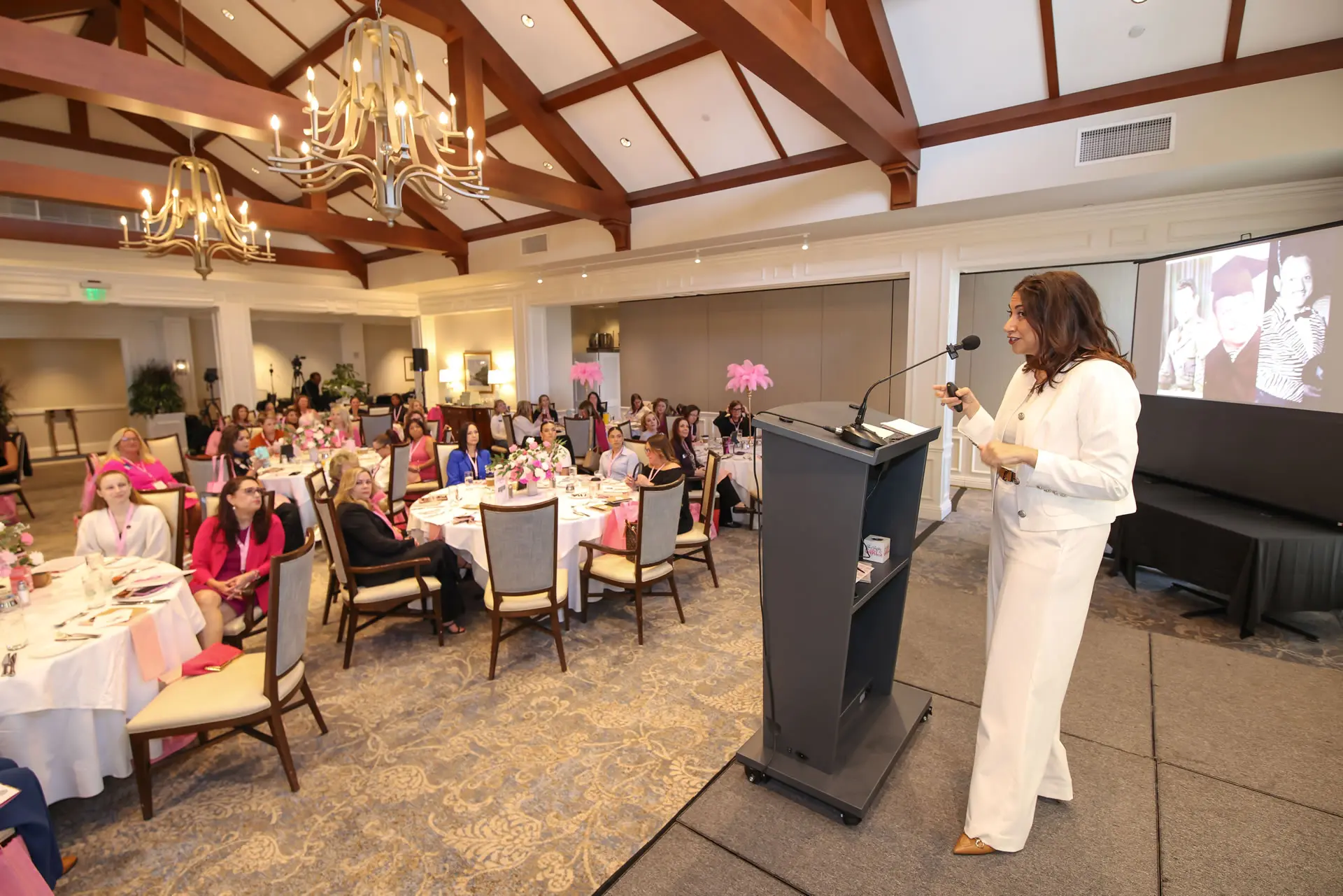Leslie Alvarez giving a professional presentation on leadership and strategic planning at a community association seminar.